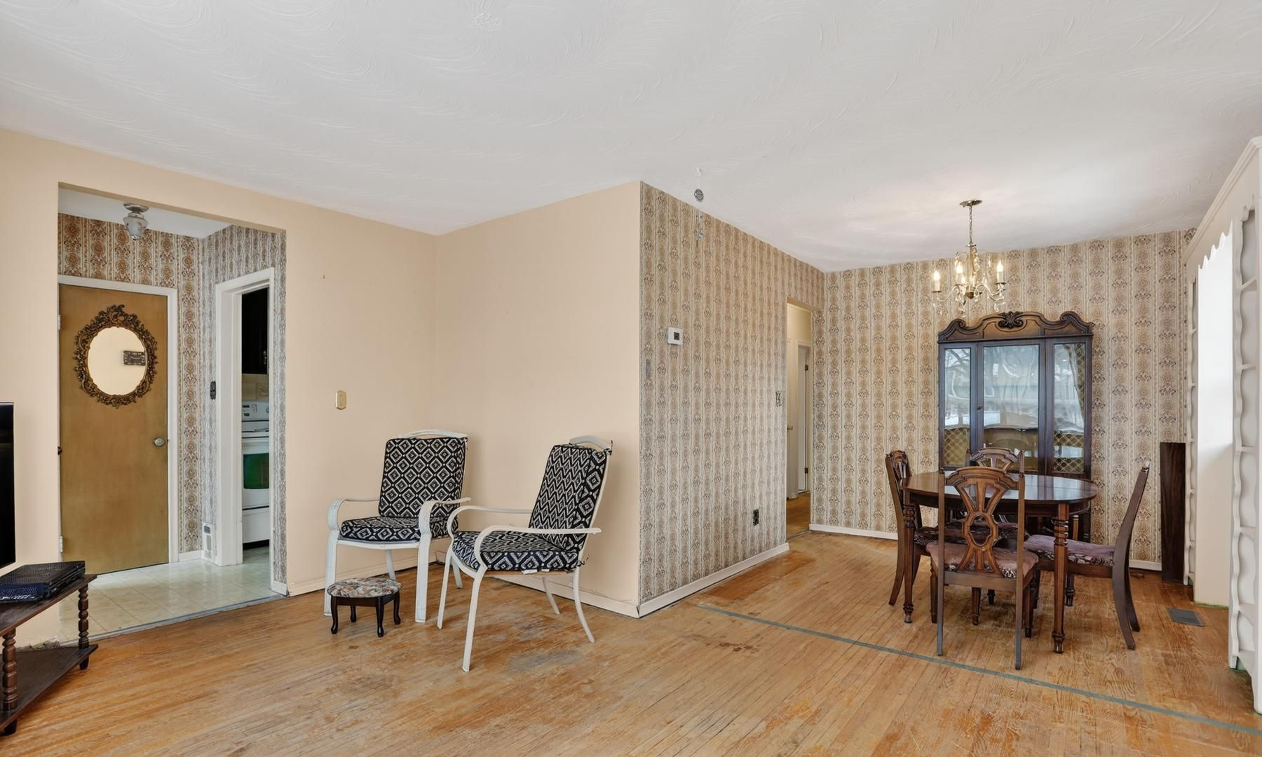 The same main-floor space before renovation, with its original closed layout