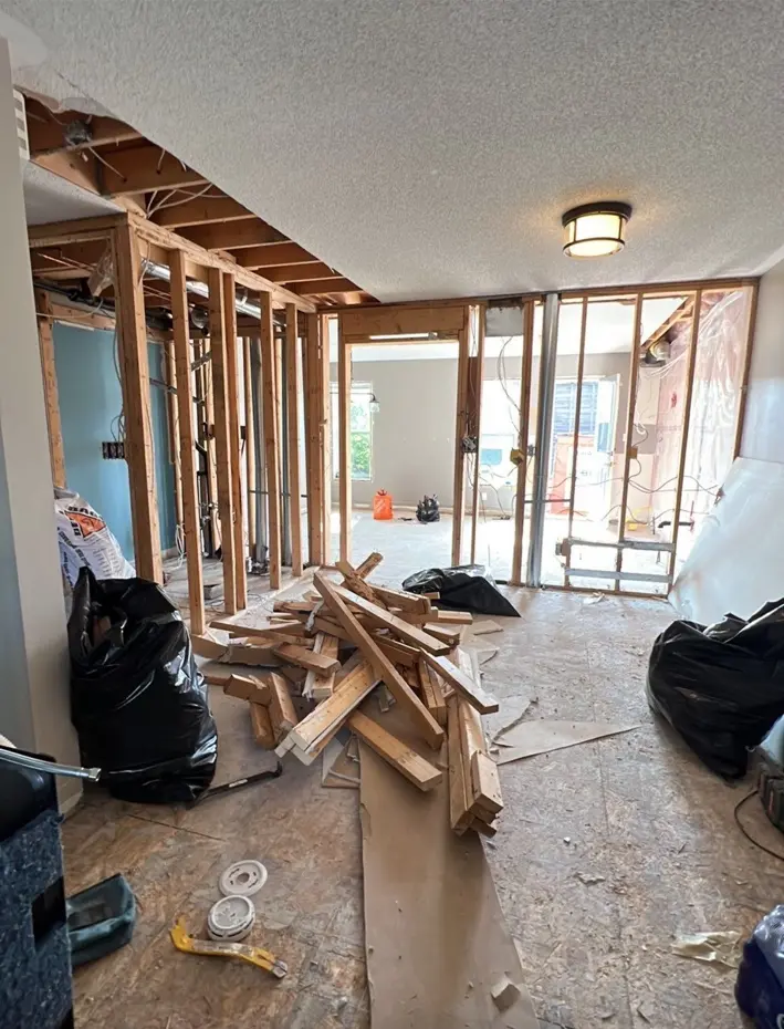 Main floor during construction as walls and framing are removed for the new open layout